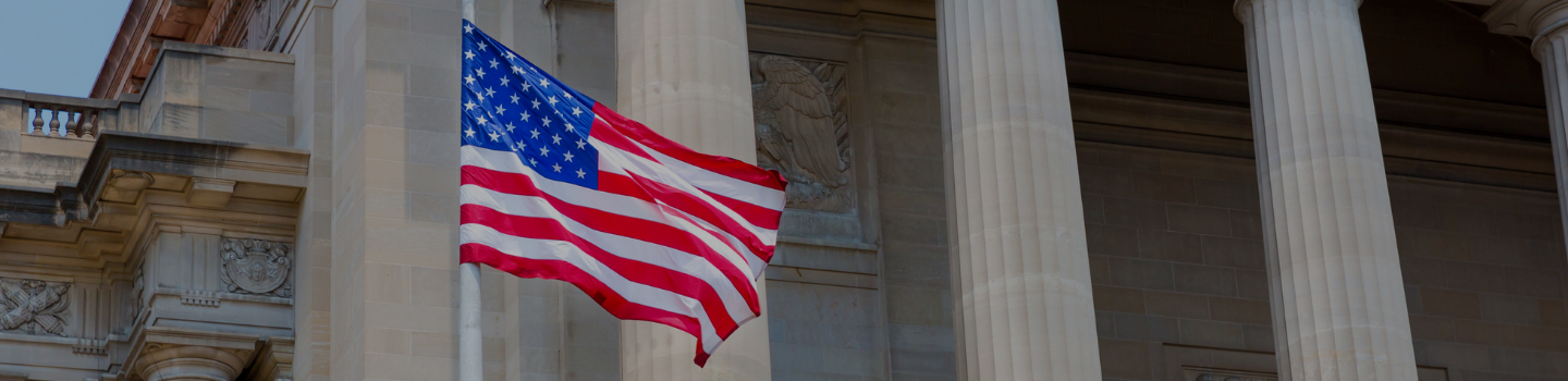 Facade of the US Supreme Court with the US flag