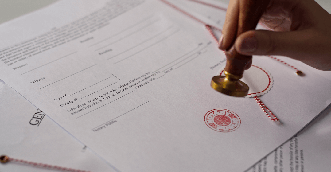 Document being stamped with a notary's seal.