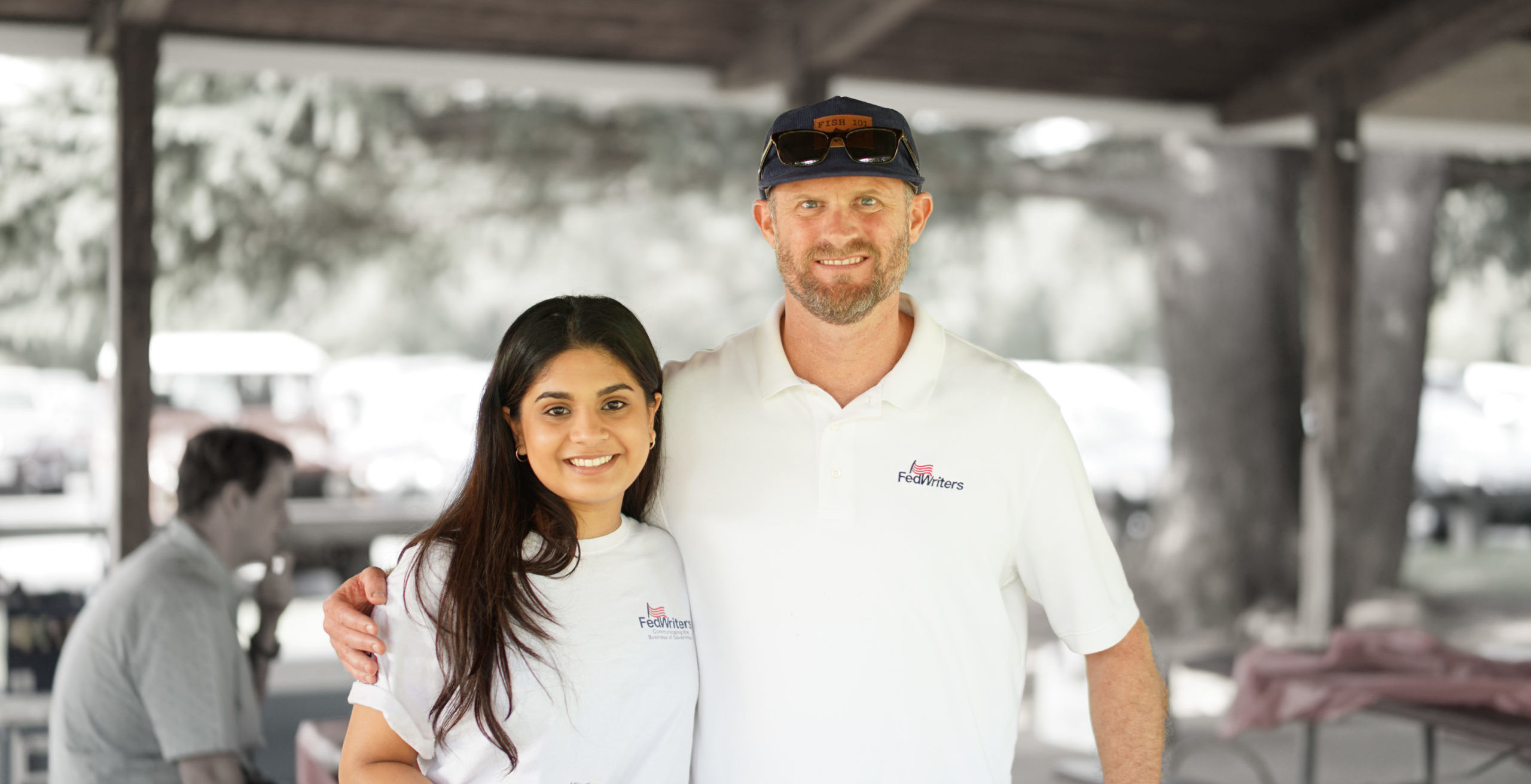 Eric Stone and Yuti Gandhi posing together at a park and wearing causal FedWriters' shirts.