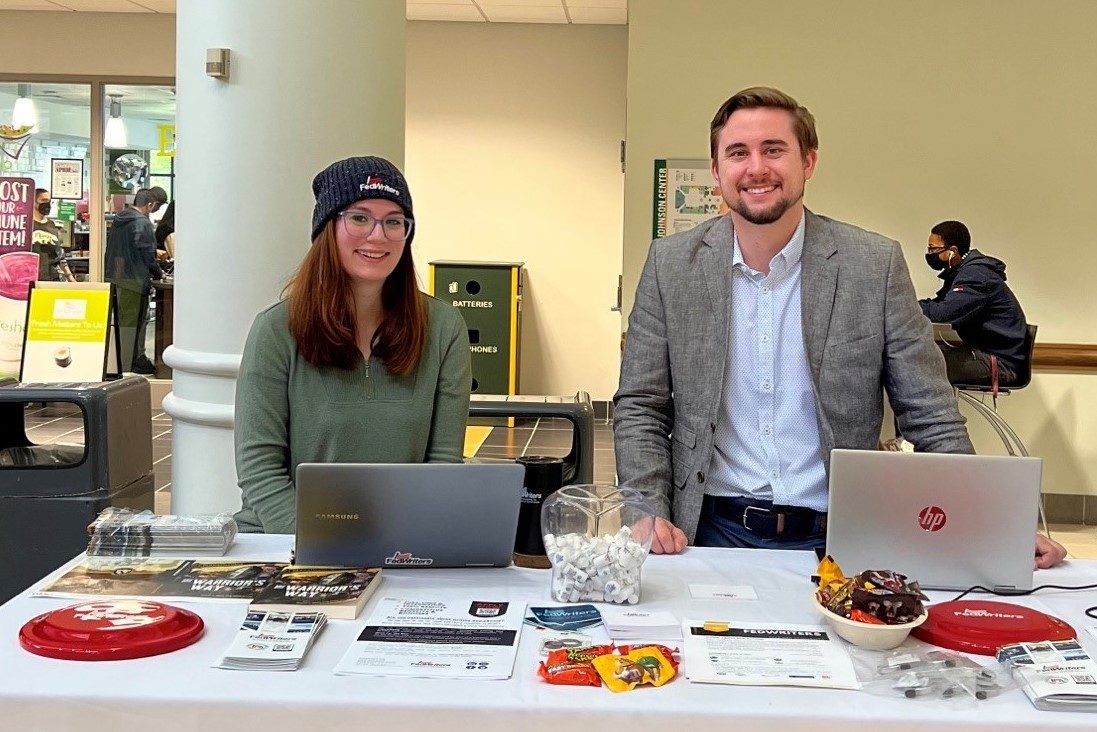 FedWriters' table at George Mason University, with treats, literature, and information about the company available to students.