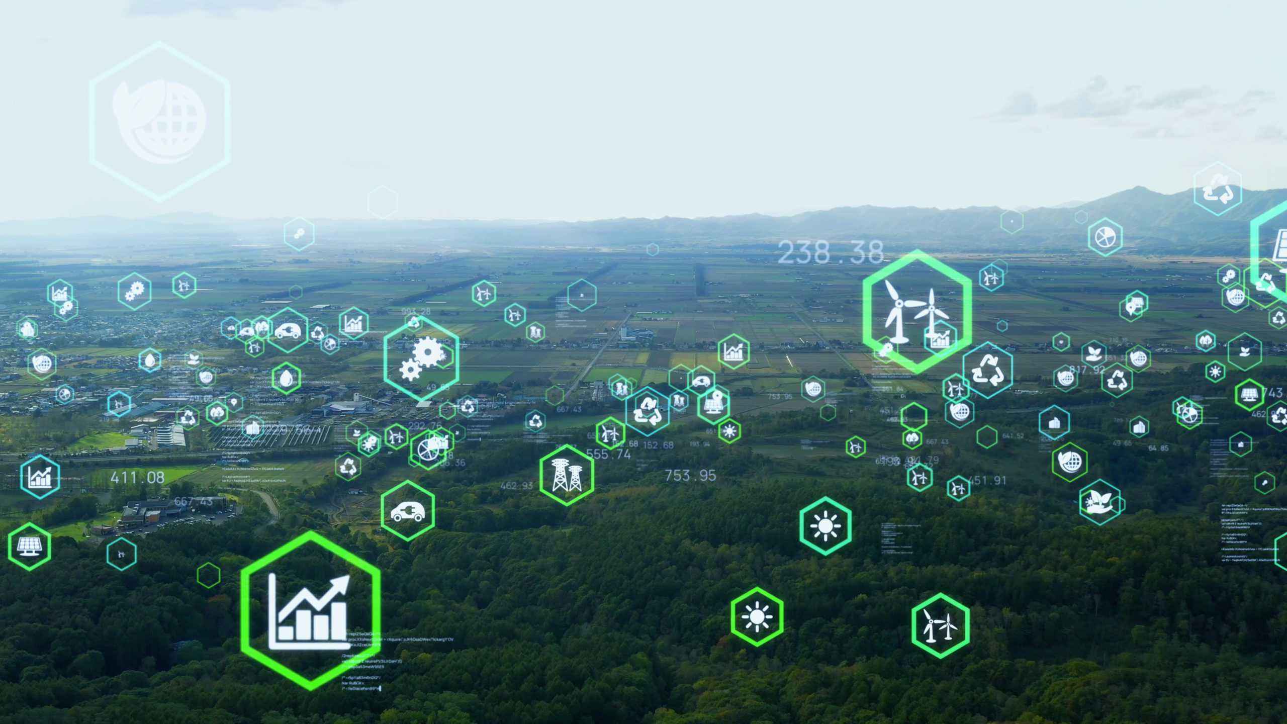 Wide green valley superimposed with many symbols, such as icons of wind turbines and the recycling symbol, enclosed in bright green hexagons