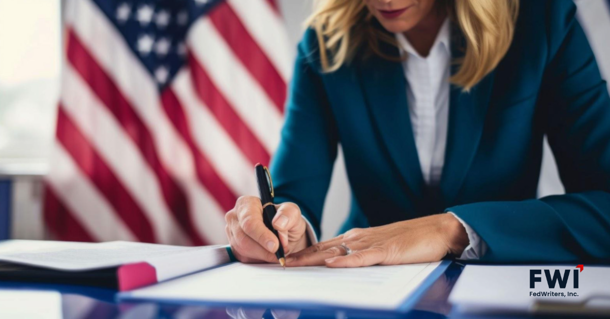 Professional signing official documents at a desk with the American flag in the background, featuring the FWI logo in the corner.