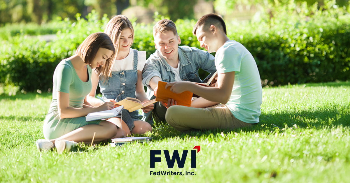 young adults reading books in the grass